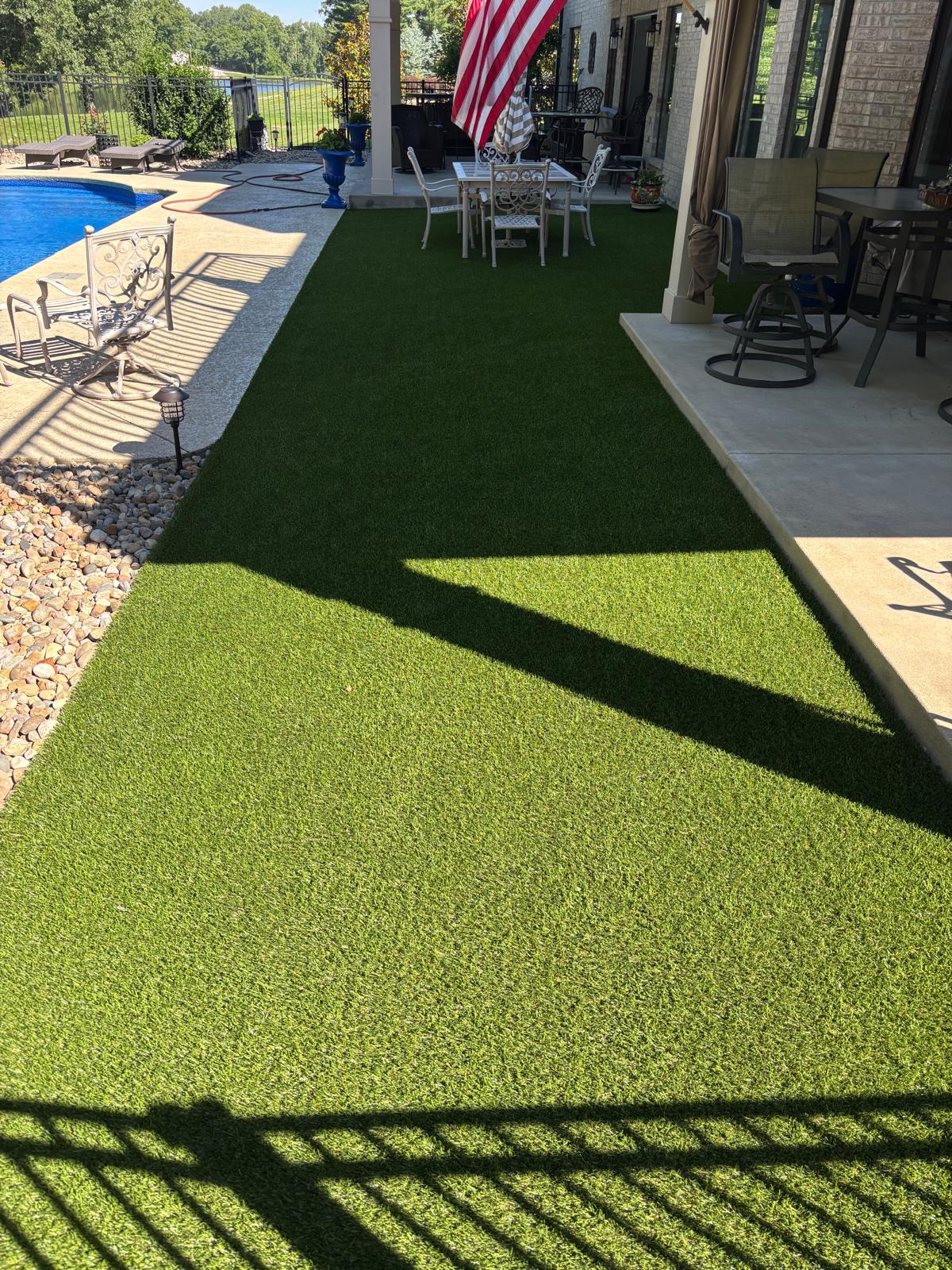 Completed artificial turf lawn with landscape lighting