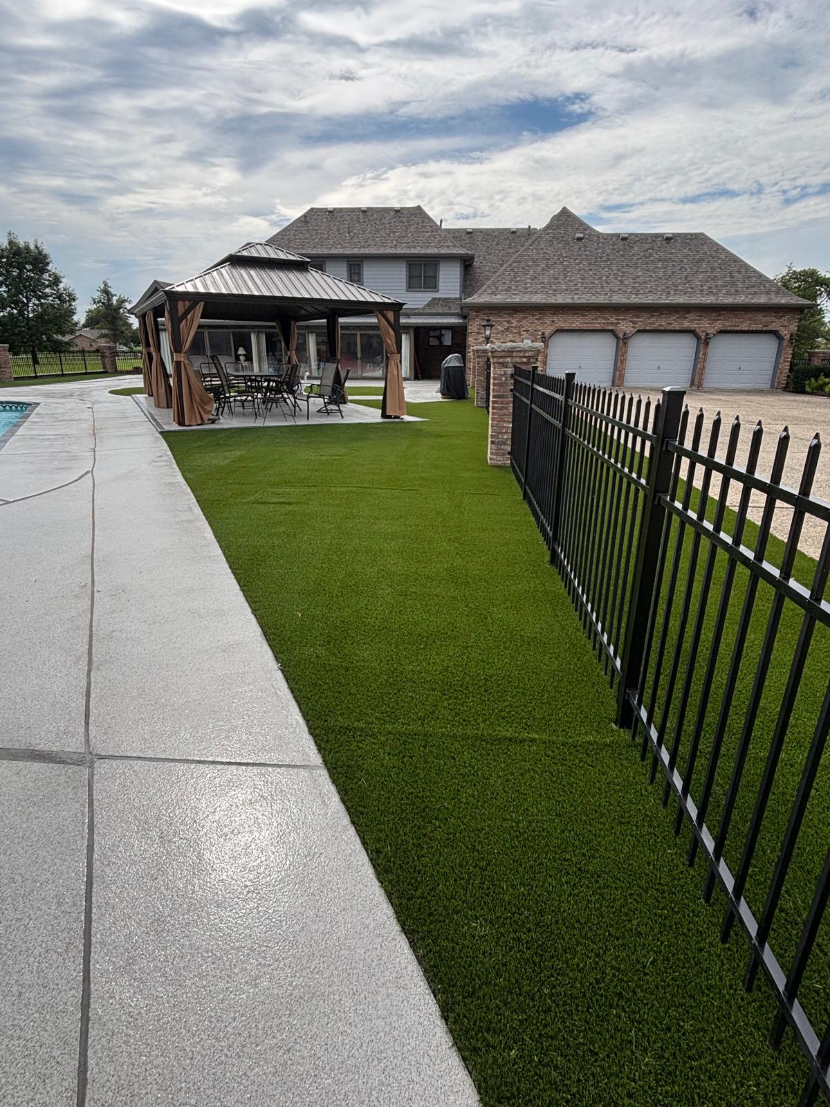 Completed turf installation near pool and patio